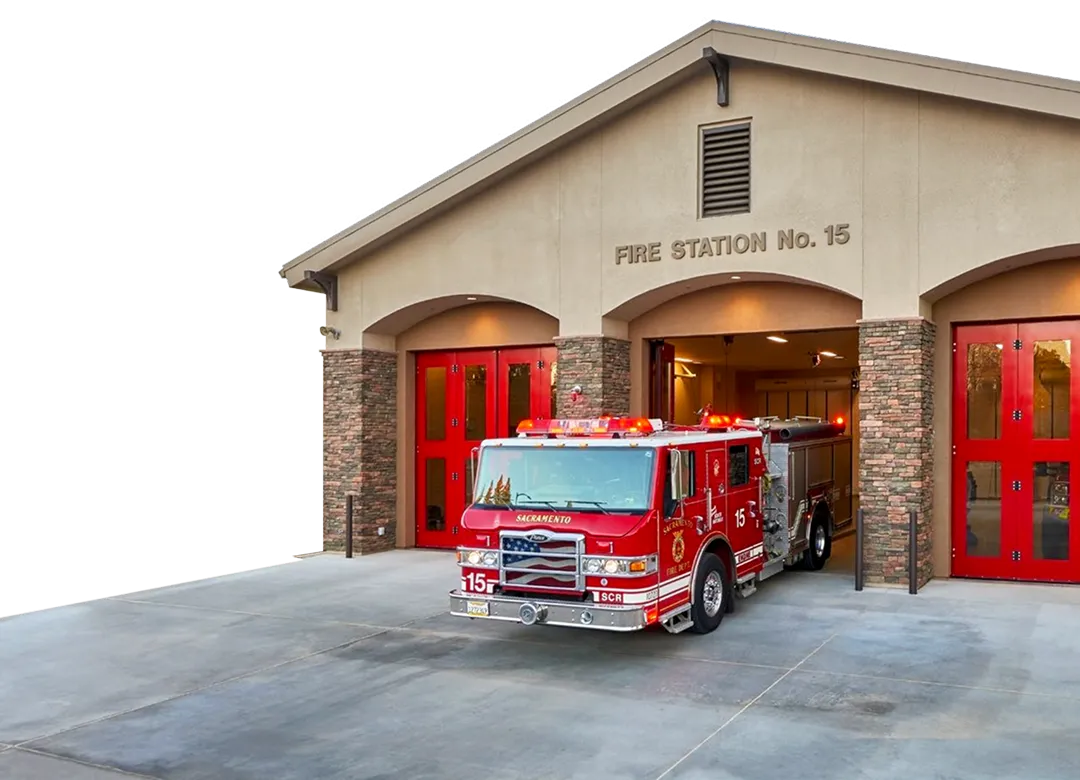 Fire Station with firetruck exiting building.