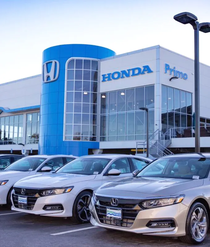 Honda dealership, with variety of cars for sale.