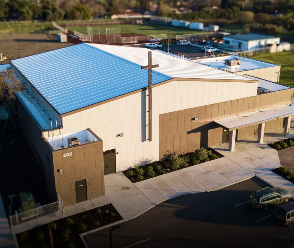 Arial view of church with cross.