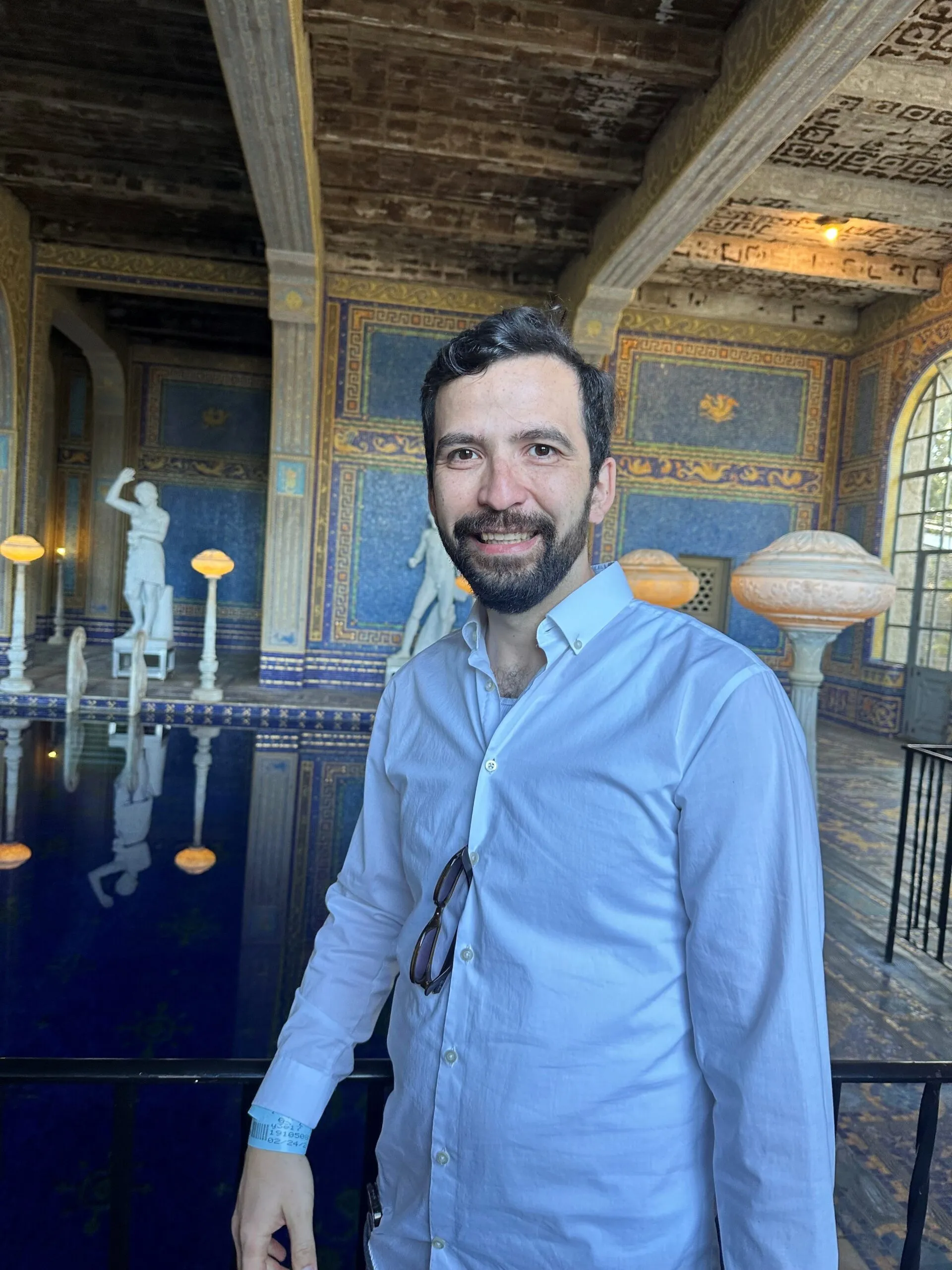 Omar Alhusami standing in front of a pool
